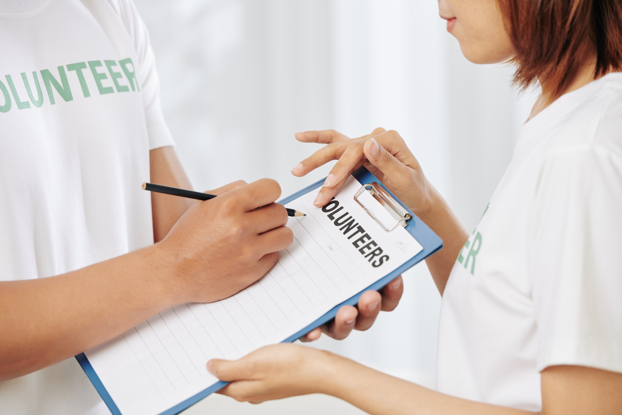 Volunteers filling document