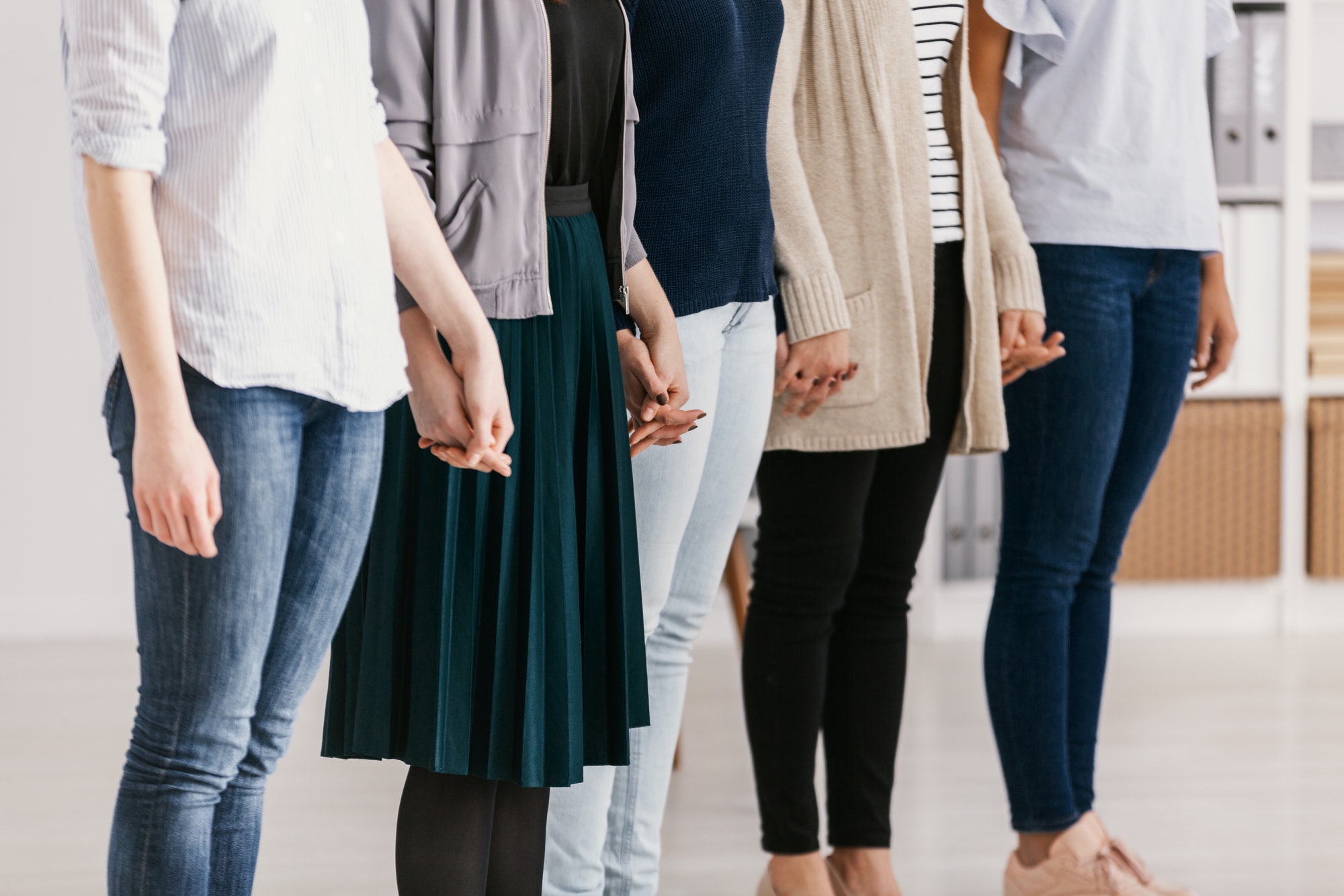 Women with issues supporting together during group therapy